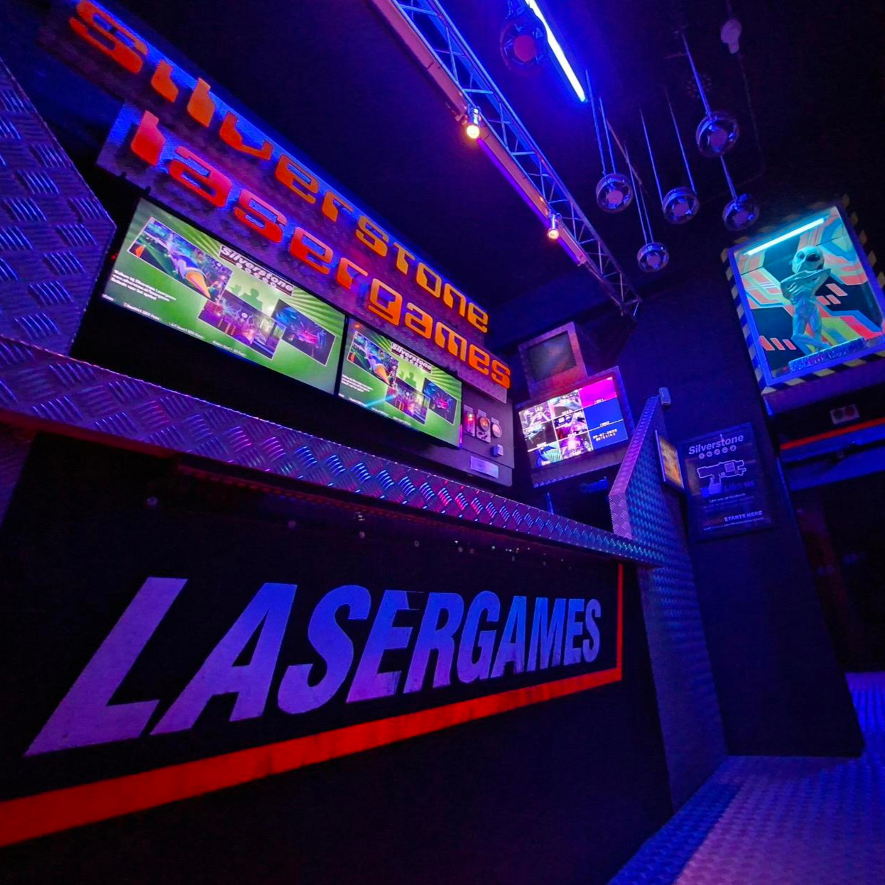 Two people playing laser tag indoors.