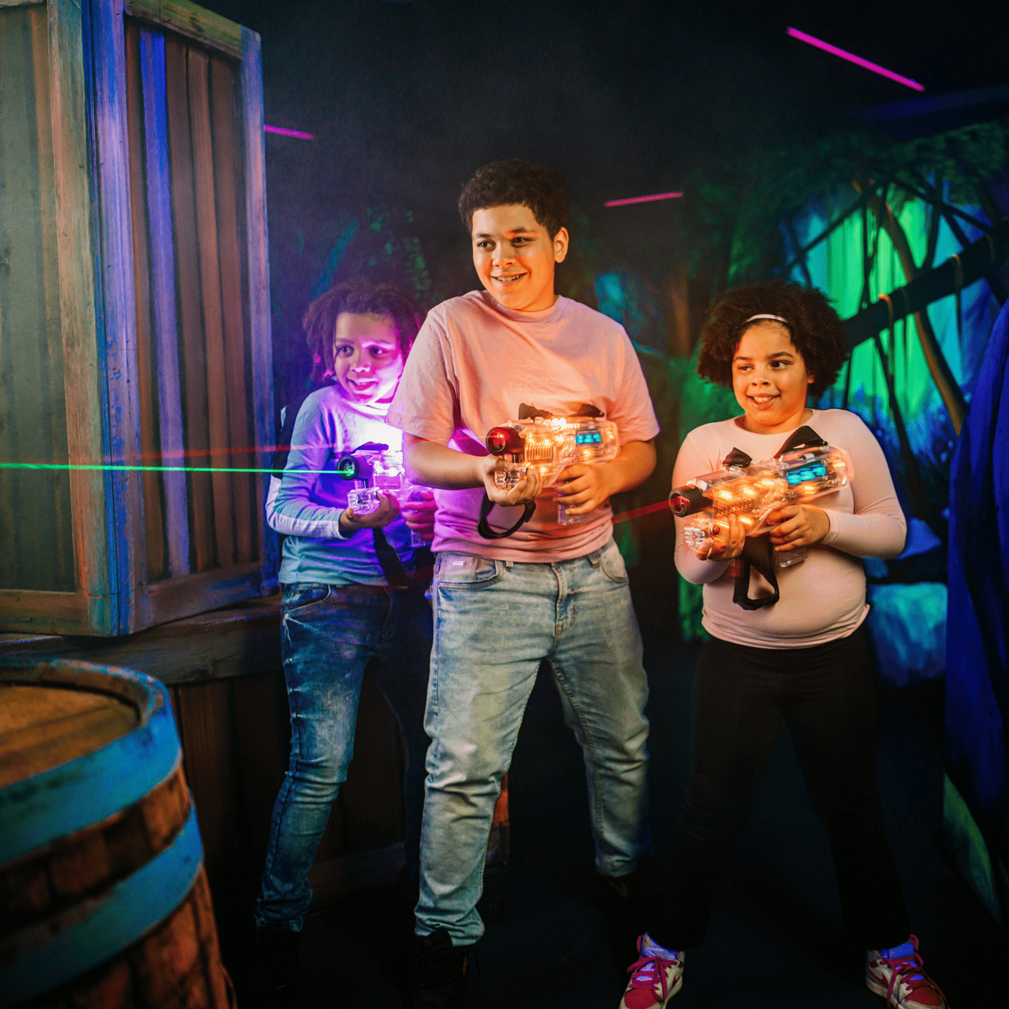 Colourful lasertag vests hanging in a row.