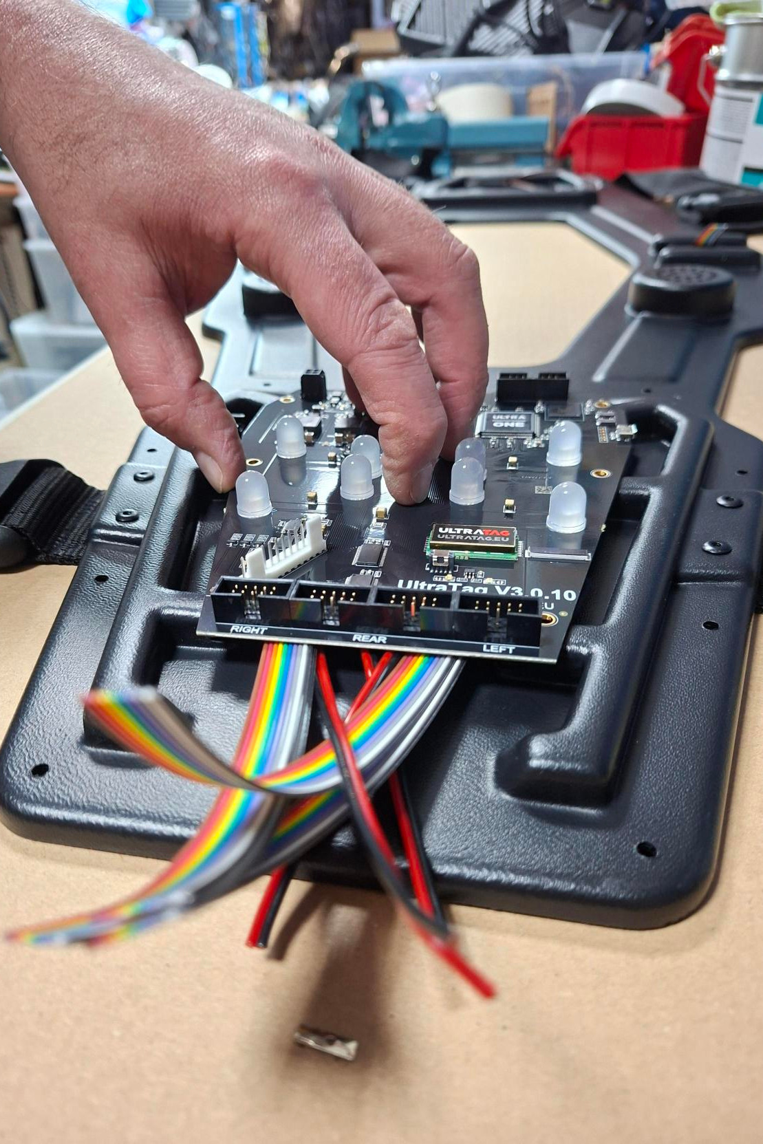 A close-up of a MiniTag Gun, a transparent lasertag gun